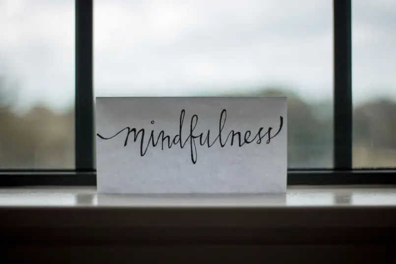 mindfulness-printed-paper-near-window